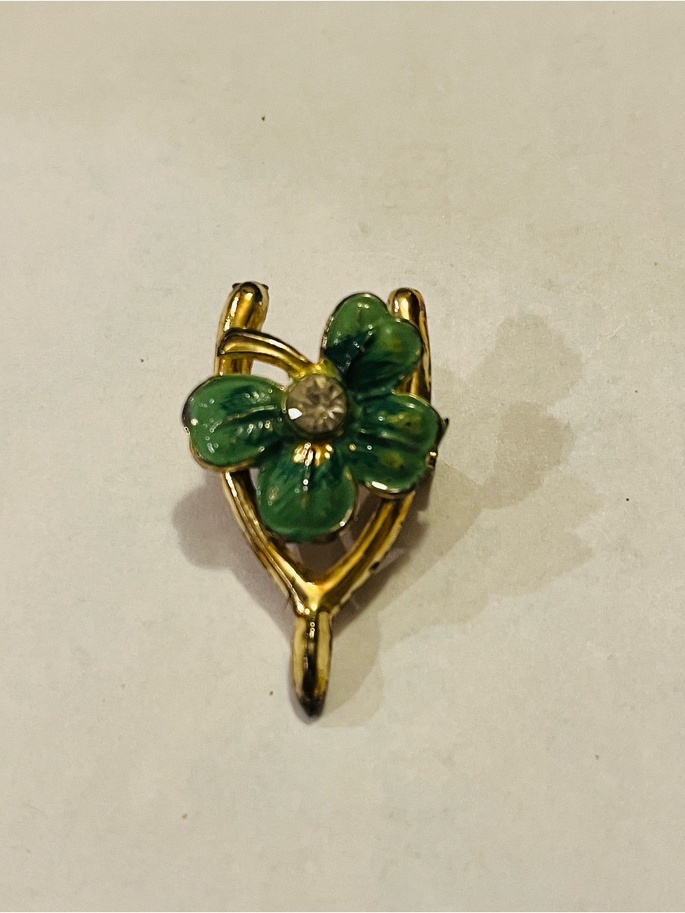 Vntg. Gold-Tone wishbone with enamel shamrock brooch and rhinestone center
